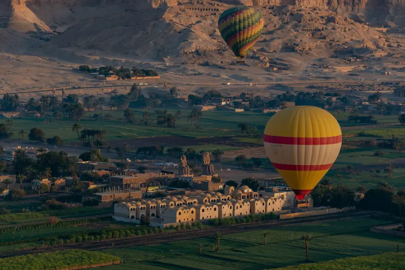 Hot-air balloons over the fields and villages of Luxor's West Bank